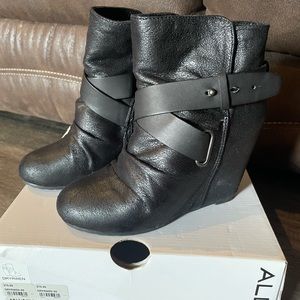 Black Aldo heeled booties.